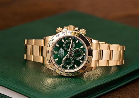 rolex watch with green face.